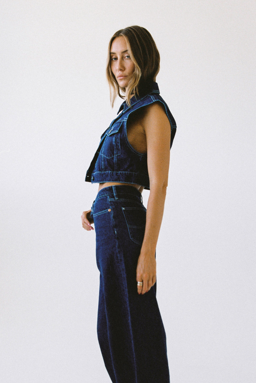 Gabi Sullivan in a dark denim Lee Signature look against a white background